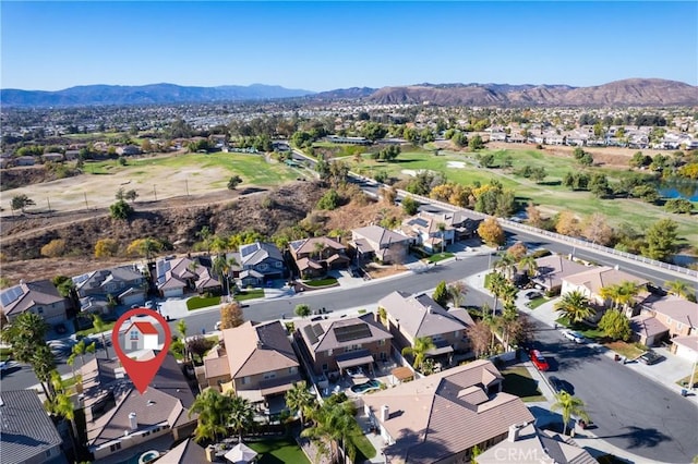 birds eye view of property with a mountain view