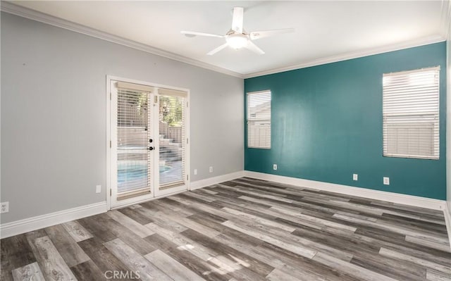 spare room featuring wood-type flooring, french doors, crown molding, and ceiling fan