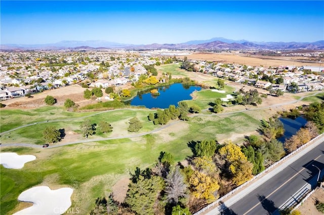 aerial view featuring a water and mountain view