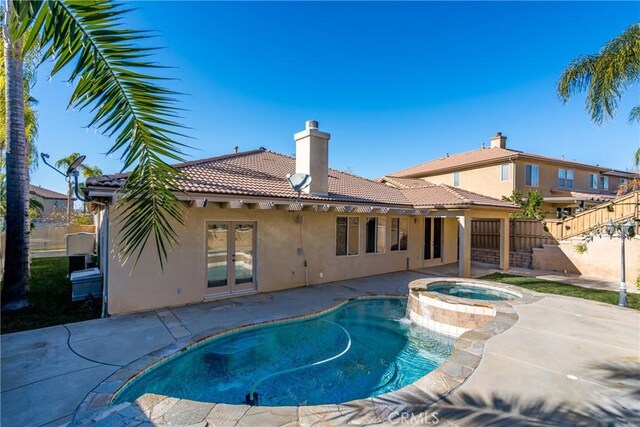 38548 Falkirk Dr, Murrieta, CA 92563 - view of swimming pool featuring french doors, a patio, and a pool with connected hot tub