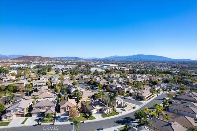 birds eye view of property with a mountain view