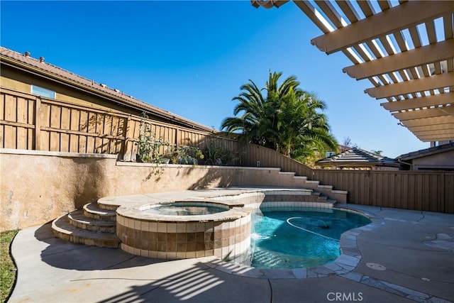 view of pool with a pergola and an in ground hot tub