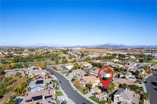 birds eye view of property with a mountain view