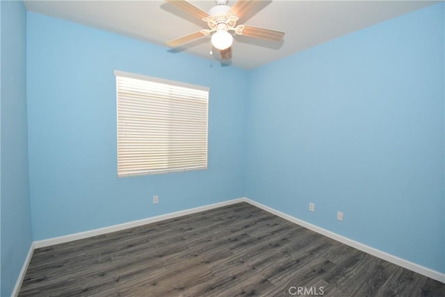 unfurnished room featuring ceiling fan and dark hardwood / wood-style flooring