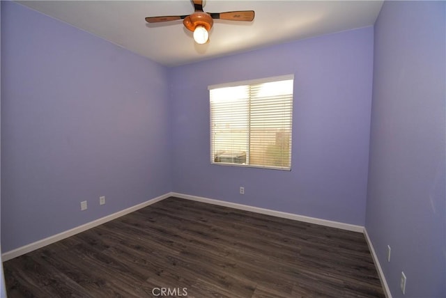 unfurnished room featuring dark hardwood / wood-style floors and ceiling fan