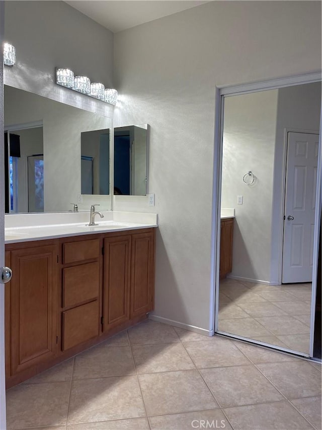 bathroom with tile patterned floors and vanity