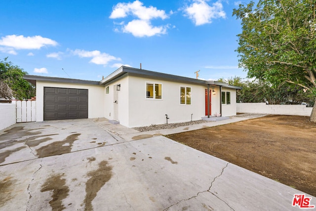 single story home with a garage