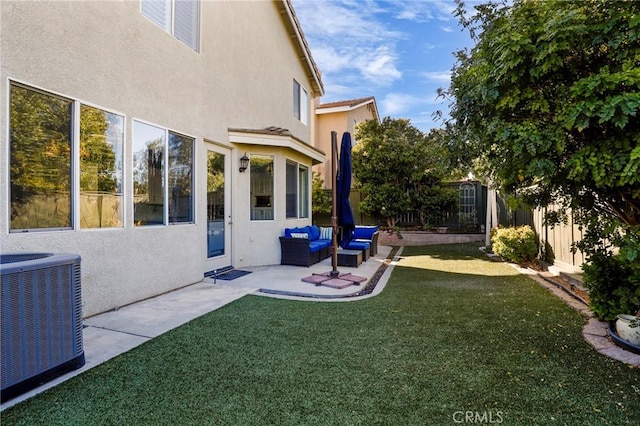 view of yard featuring central AC, a patio area, and an outdoor living space