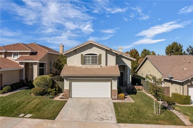 view of front of house featuring a front lawn and a garage