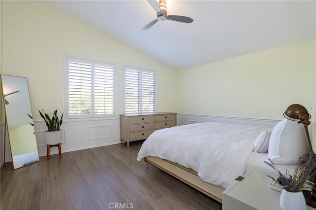 bedroom featuring ceiling fan, hardwood / wood-style floors, and lofted ceiling