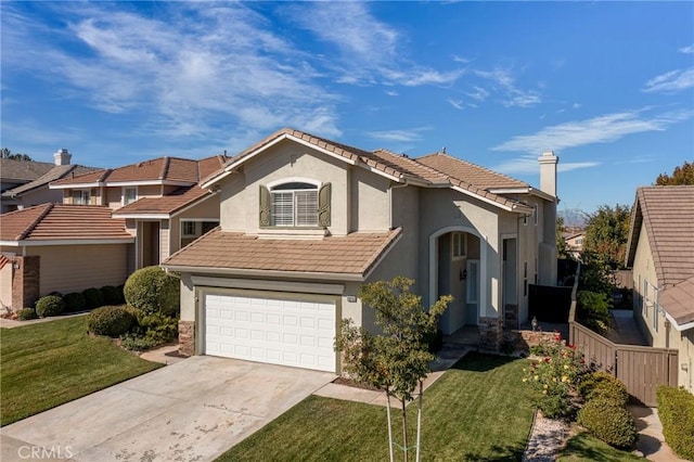 view of front facade featuring a garage and a front yard