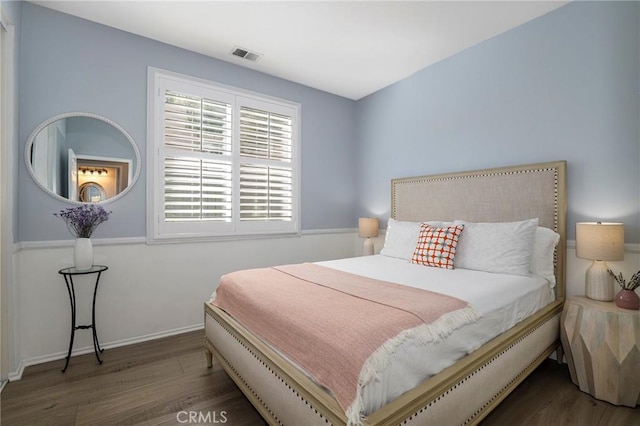 bedroom featuring hardwood / wood-style floors