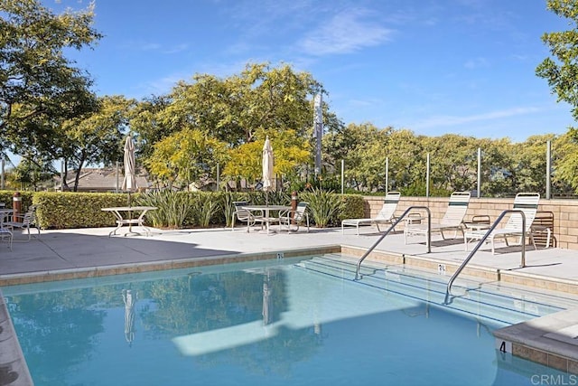 view of pool featuring a patio