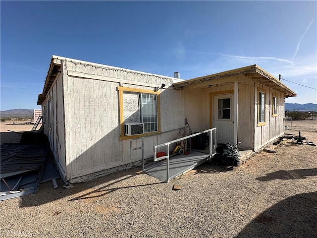 back of house with a mountain view