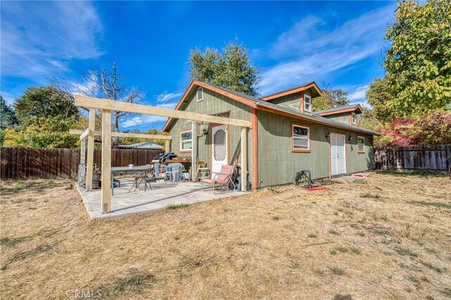 rear view of house with a patio area