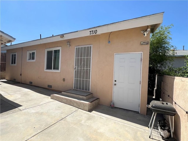 back of property featuring a patio