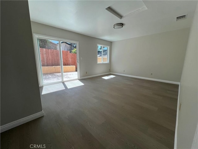 unfurnished room featuring dark hardwood / wood-style floors