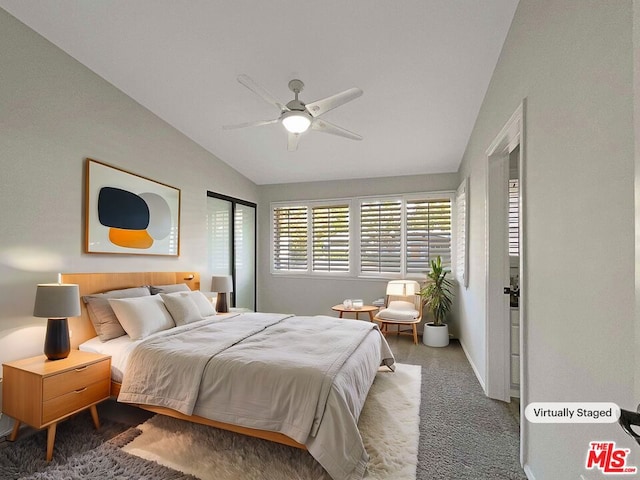 bedroom with carpet flooring, ceiling fan, and vaulted ceiling