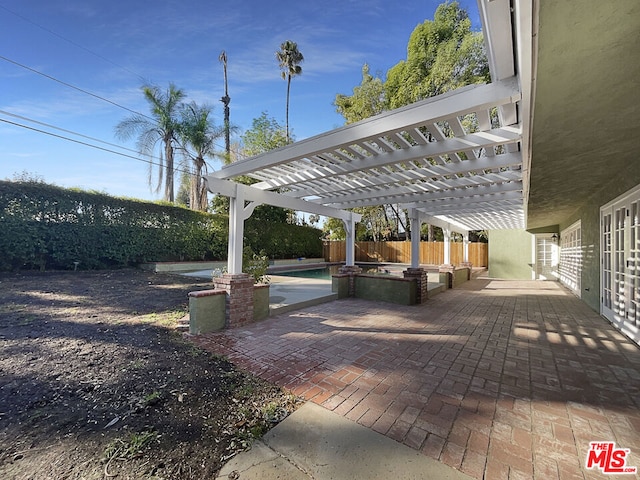 view of patio / terrace featuring a pergola and a fenced in pool