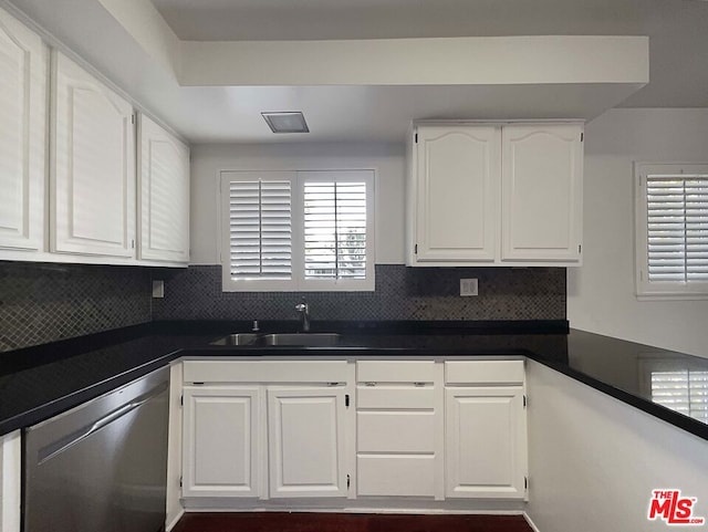 kitchen featuring dishwasher, white cabinetry, and sink