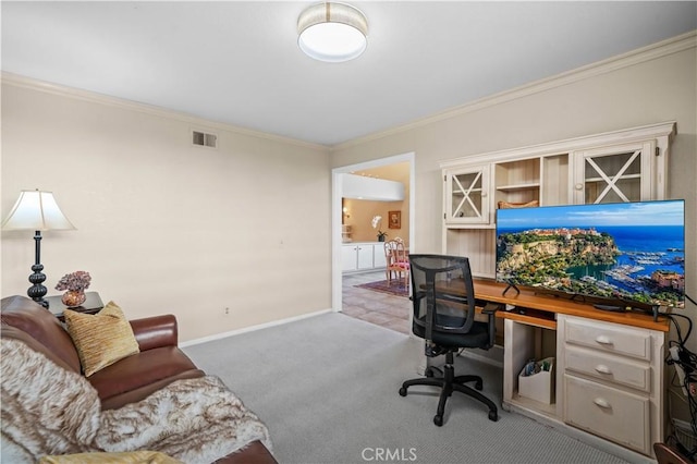 carpeted office featuring crown molding