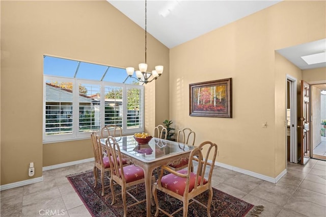 dining area featuring a notable chandelier, high vaulted ceiling, and light tile patterned floors