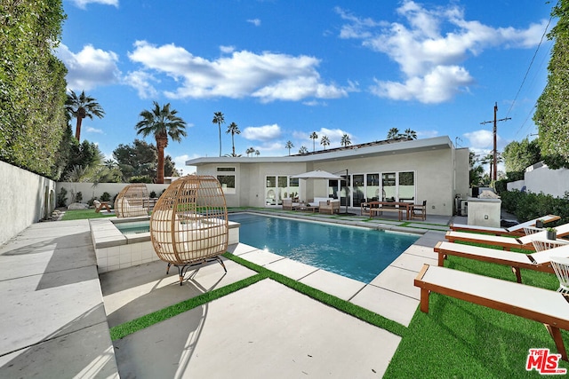 view of swimming pool featuring outdoor lounge area and a patio area