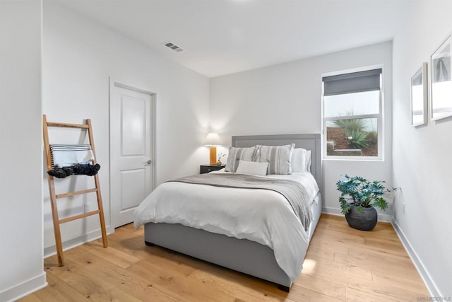 bedroom with light hardwood / wood-style flooring