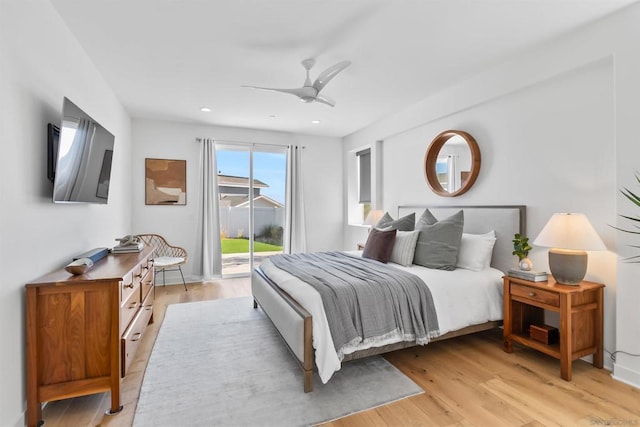 bedroom with access to exterior, ceiling fan, and light wood-type flooring