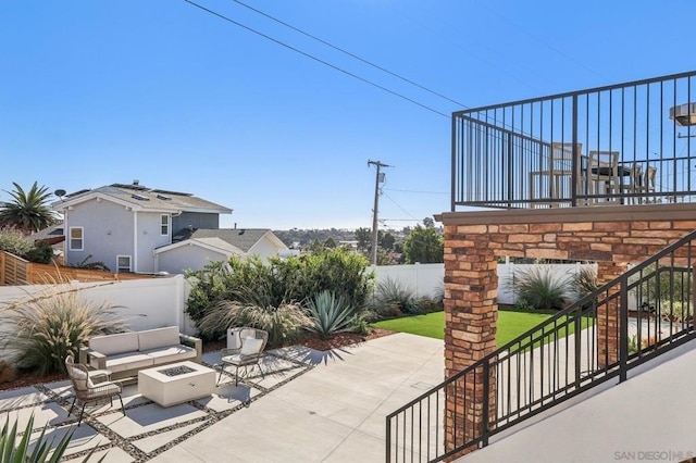 view of patio / terrace with an outdoor fire pit