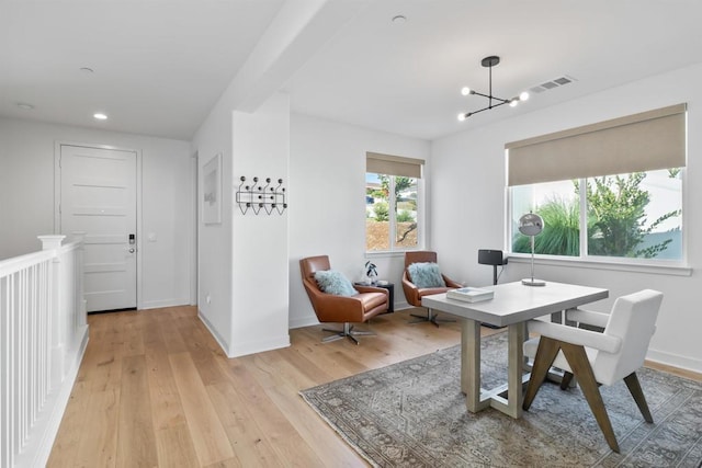 dining room featuring a chandelier and light wood-type flooring