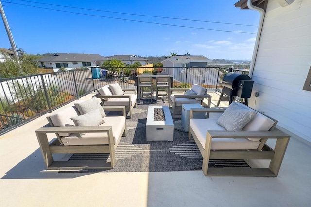 view of patio / terrace featuring an outdoor living space with a fire pit