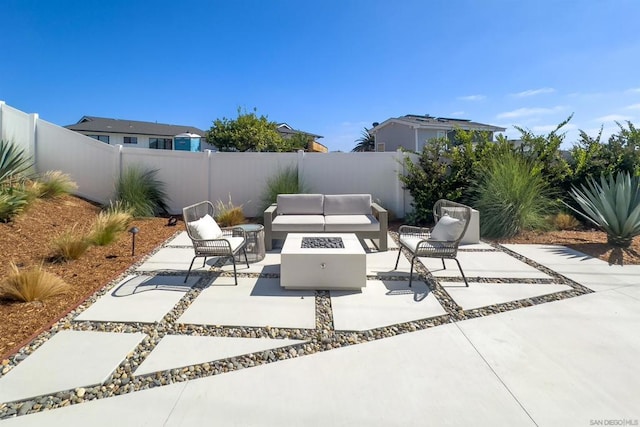 view of patio / terrace with an outdoor living space with a fire pit