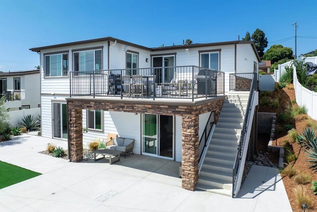 rear view of house with a patio area