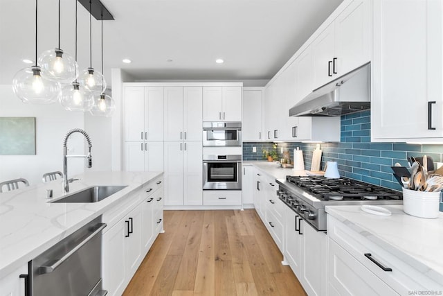 kitchen featuring sink, stainless steel appliances, and white cabinets