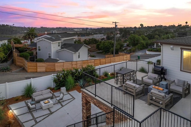 patio terrace at dusk with an outdoor fire pit