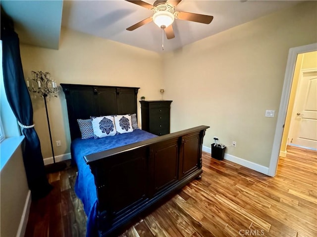 bedroom featuring light hardwood / wood-style floors and ceiling fan