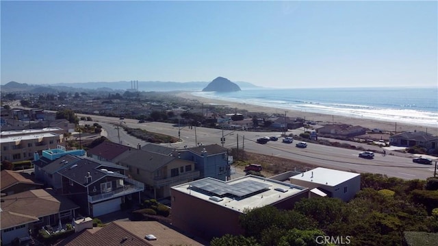 aerial view featuring a water view and a beach view