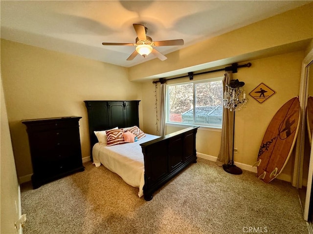 bedroom featuring ceiling fan and light carpet