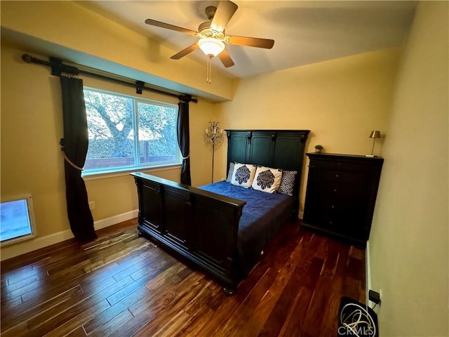 bedroom featuring ceiling fan and dark wood-type flooring