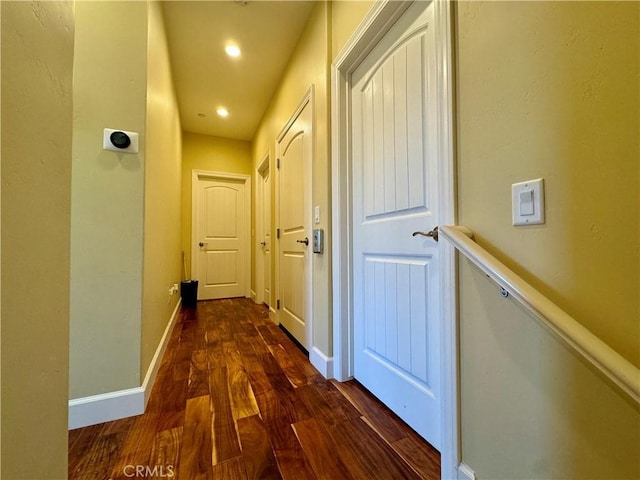 hall with dark hardwood / wood-style floors