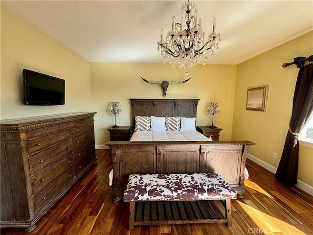 bedroom featuring dark wood-type flooring and an inviting chandelier