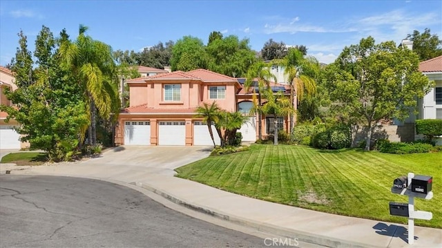 mediterranean / spanish-style house with a front lawn and a garage