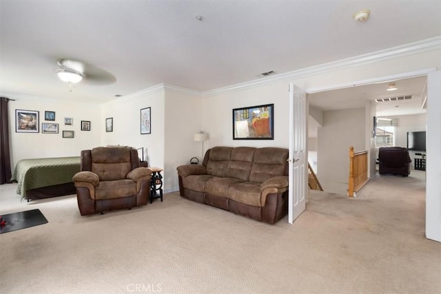 living room featuring light colored carpet, ceiling fan, and ornamental molding