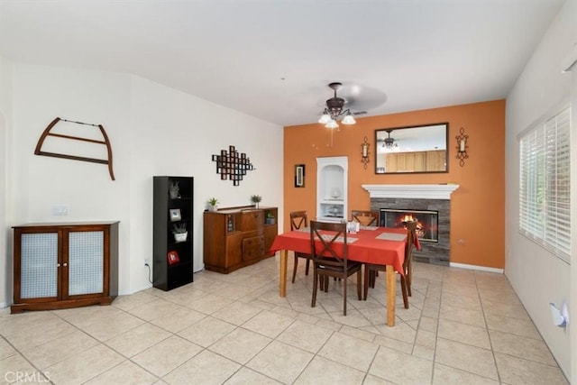 dining area featuring ceiling fan and light tile patterned floors