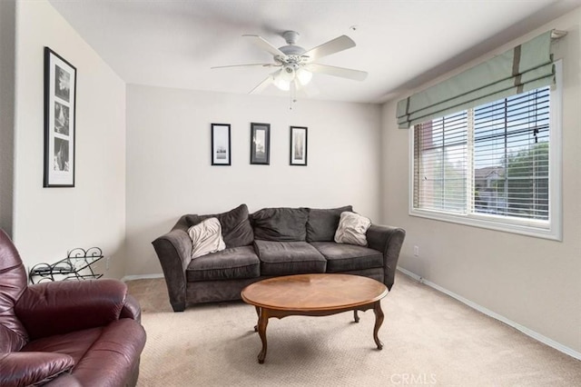 carpeted living room featuring ceiling fan