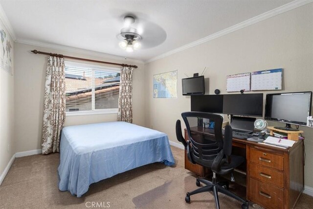 carpeted bedroom featuring ceiling fan and ornamental molding