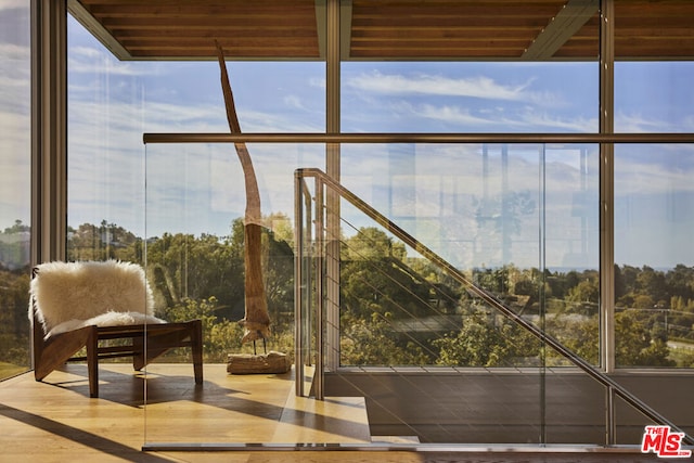 unfurnished sunroom with a healthy amount of sunlight and wood ceiling