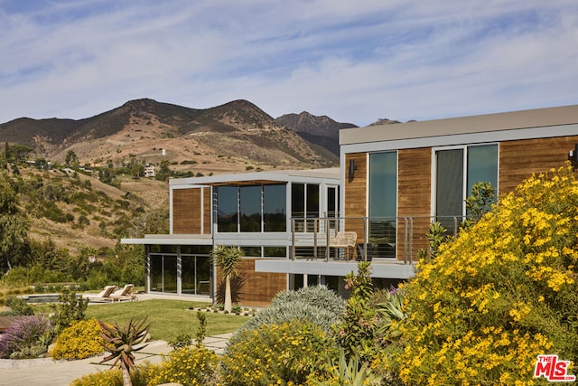 rear view of house with a mountain view