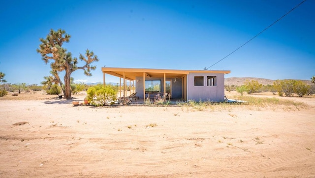 exterior space featuring a mountain view and covered porch